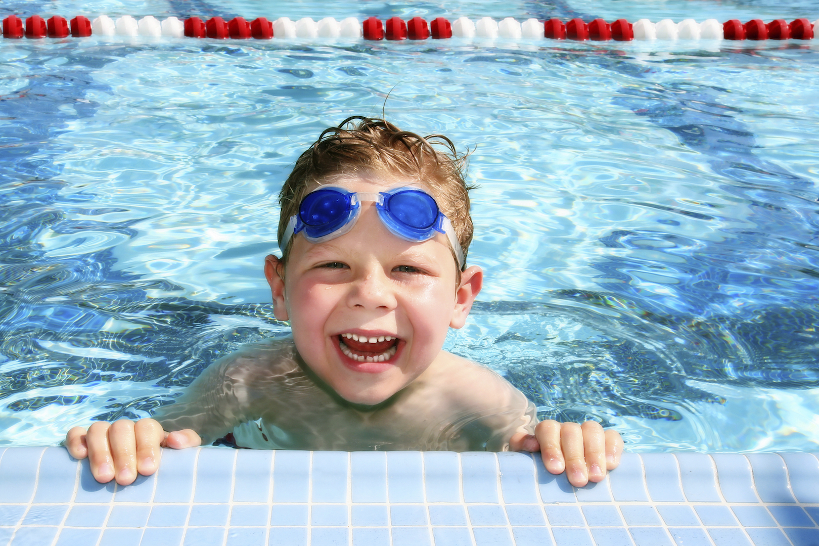 Happy child in a swimming pool
