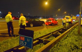 Flinke schade bij kop-staart aanrijding op snelweg, Rijksweg A4 in Leiden